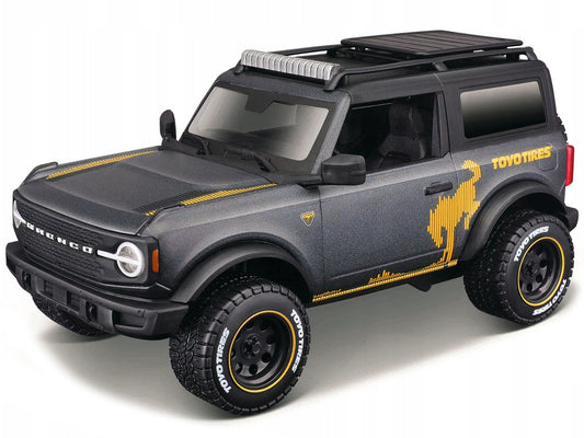 2021 Ford Bronco Badlands Dark Gray Metallic with Gold Graphics and Roof Rack "Off-Road" "Maisto Design" Series 1/24 Diecast Model Car by Maisto-0