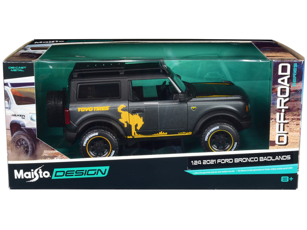 2021 Ford Bronco Badlands Dark Gray Metallic with Gold Graphics and Roof Rack "Off-Road" "Maisto Design" Series 1/24 Diecast Model Car by Maisto-1